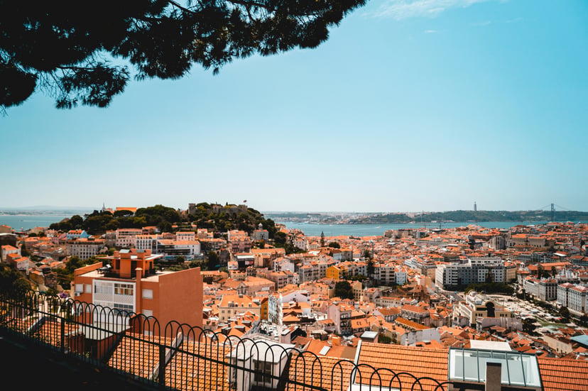 View across the rooftops of Lisbon, looking out to sea