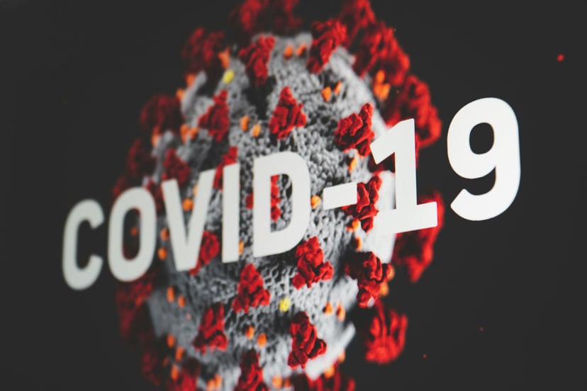 Close up of a virus and the words COVID-19