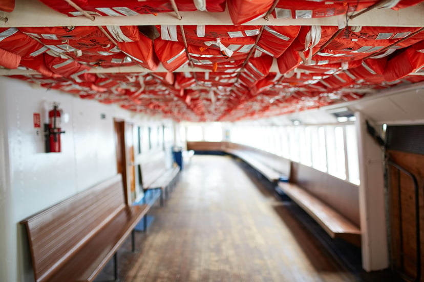 life jackets stored in the ceiling of a ferry