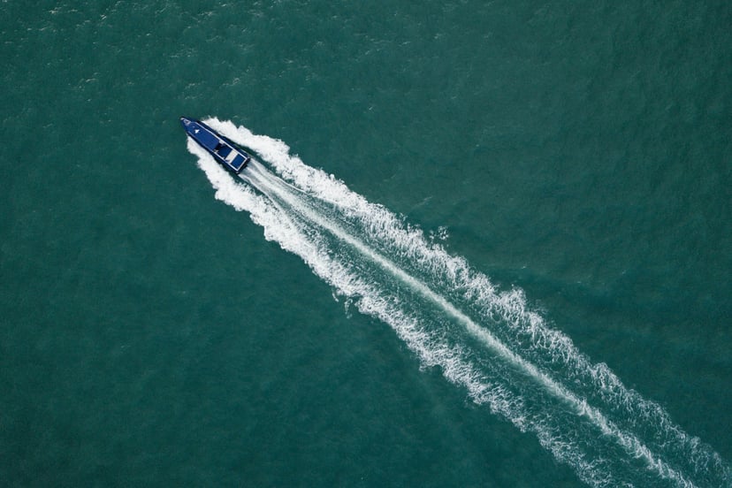 aerial view of a speed boat and its wake