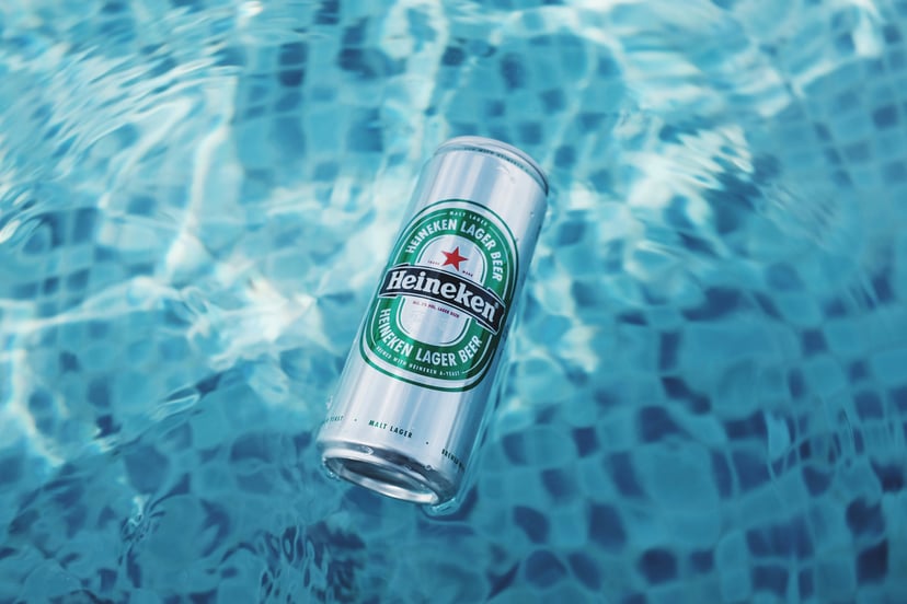A can of Heineken floating in a swimming pool
