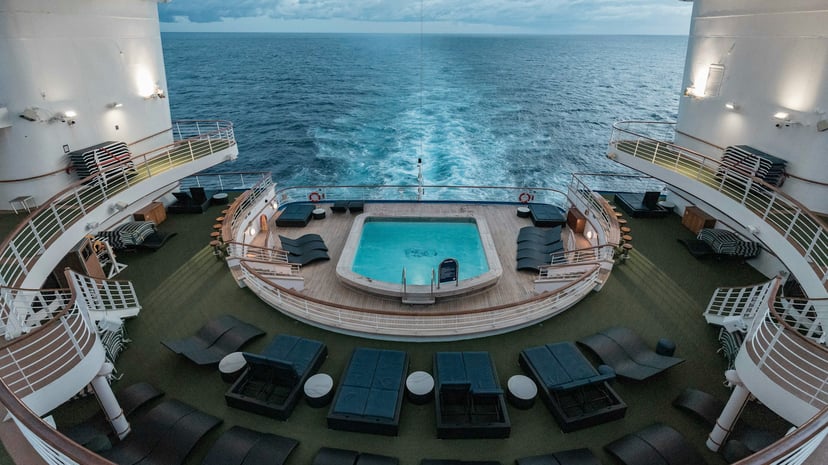 a small swimming pool on the deck at the stern of a cruise ship
