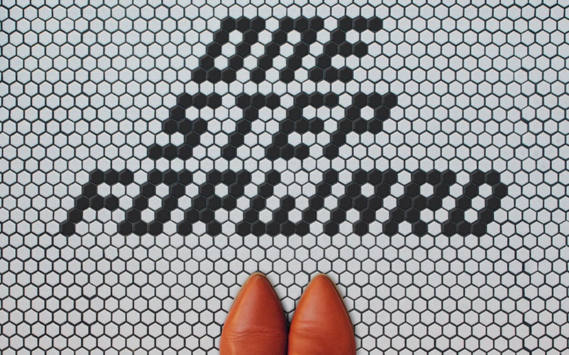 a tiled floor that says 'one step forward'