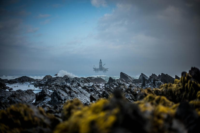 A rig out at sea seen through mist