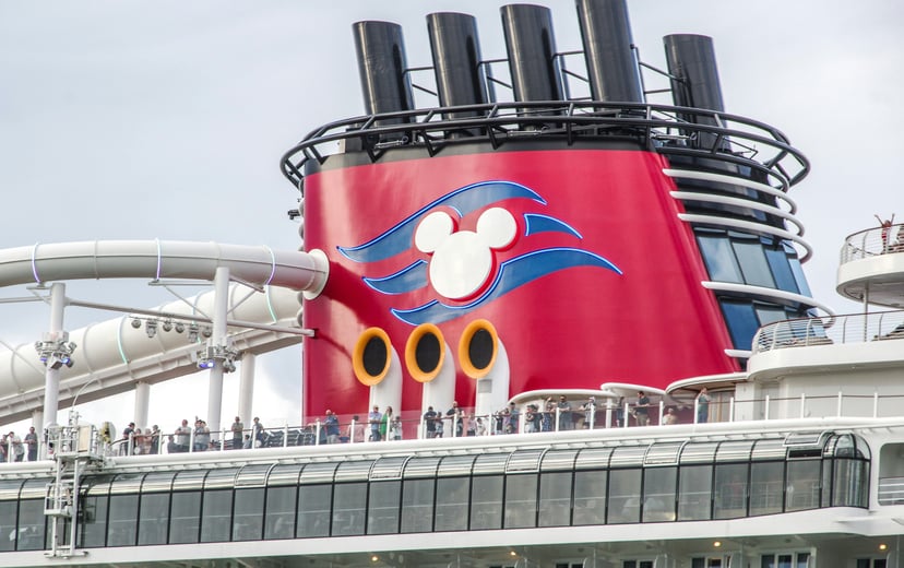 The Disney cruise logo on the funnel of one of the line's cruise ships