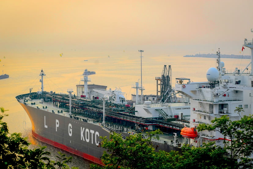 An LPG carrier docked in a port at sundown