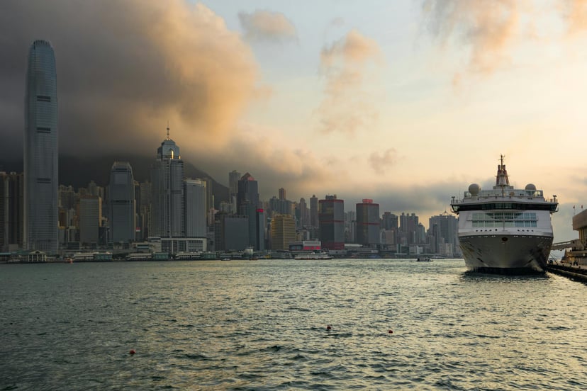 A cruise ship with Hong Kong island in the background