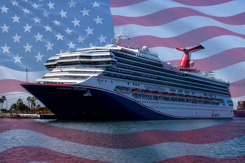 A Carnival cruise ship with the Stars and Stripes flag in the background