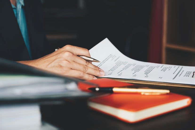 A person looking at a resume