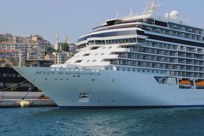 The Regent Seven Seas Grandeur cruise ship docked in a port