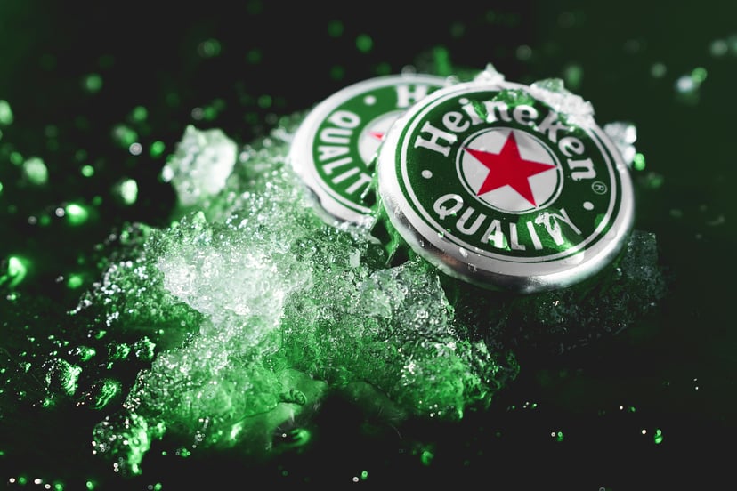 Heineken bottle caps on ice