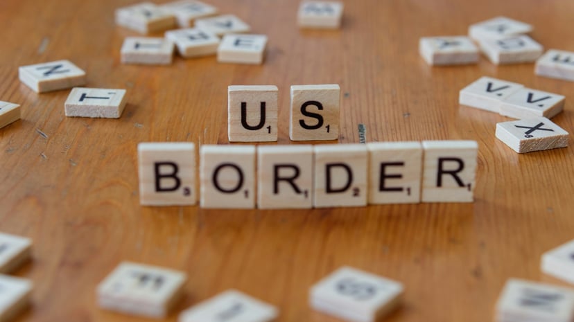 Scrabble tiles spelling out 'U.S' Border'