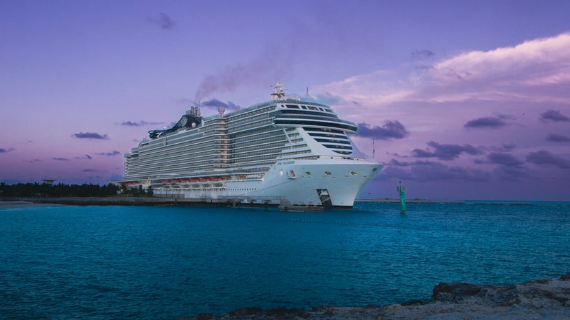 The MSC Seashore cruise ship under a purple evening sky