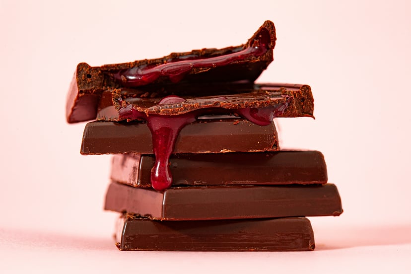Slabs of chocolate with chocolate sauce drizzled over them