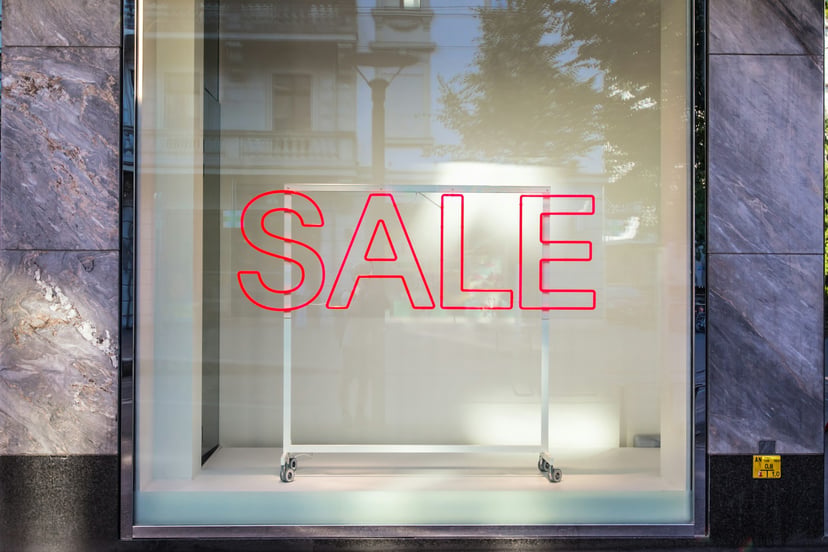 A sale sign in a shop window