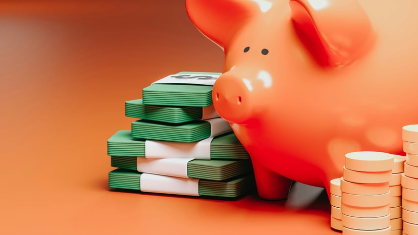 a piggy bank and stacks of coins and bank notes