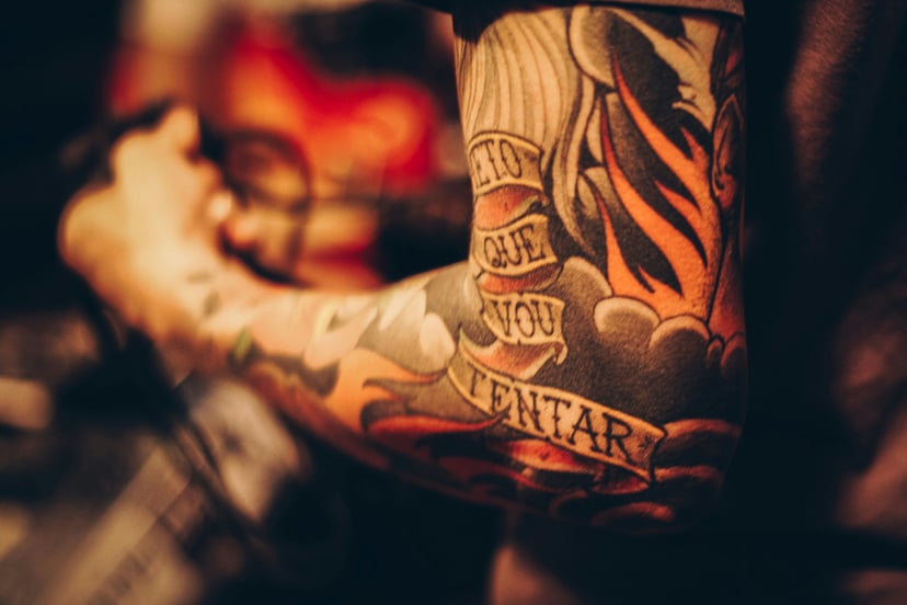 A heavily tattooed arm