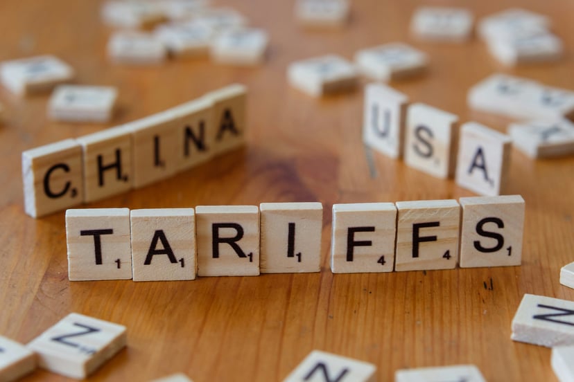 Scrabble tiles spelling out the words 'China USA Tariffs'