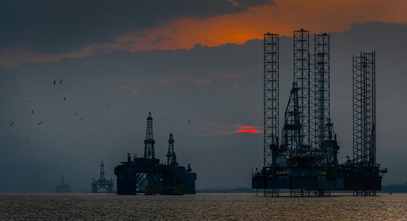 Oil rigs in the North Sea at sundown