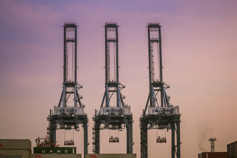 Cranes at a port in Thailand at sunset