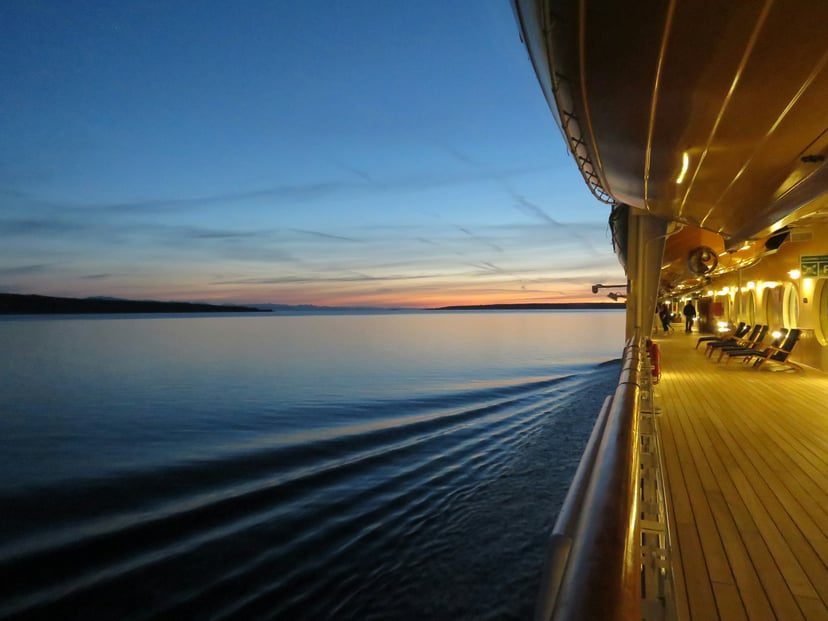 the deck of a cruise ship at night