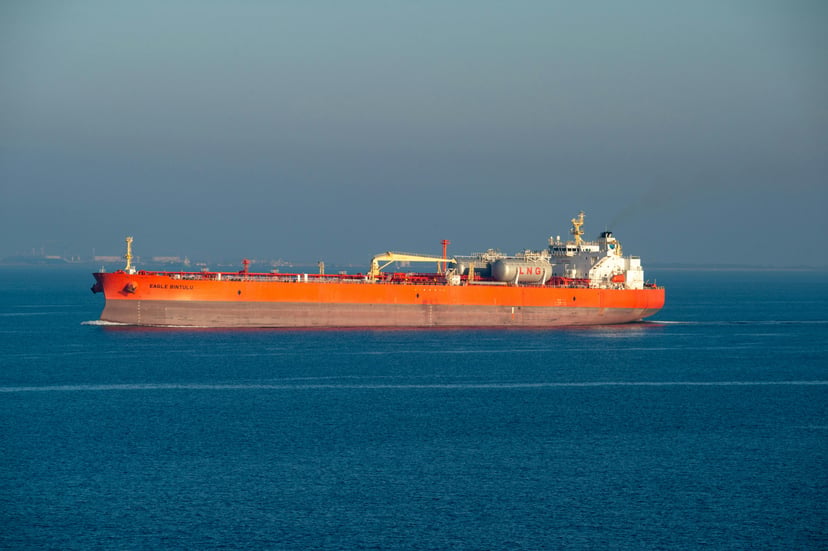 an orange LNG carrier at sea