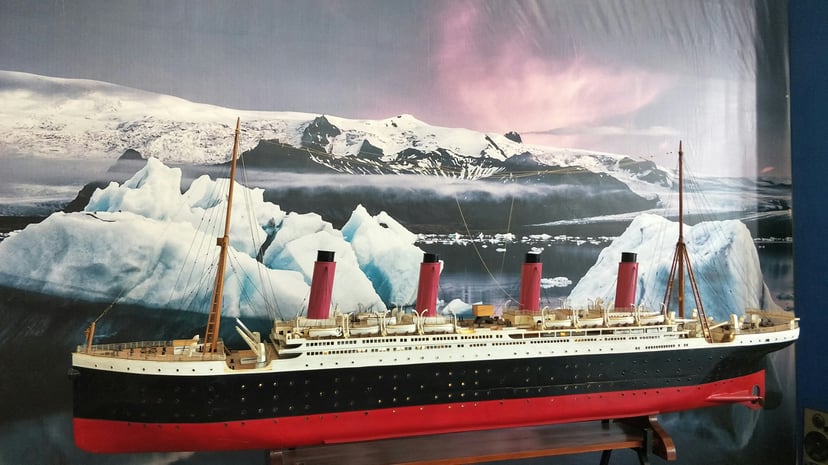 a model of the cruise liner Titanic in a display case in a museum