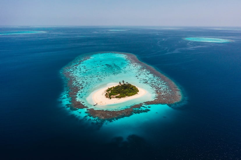An aerial view of a remote desert island