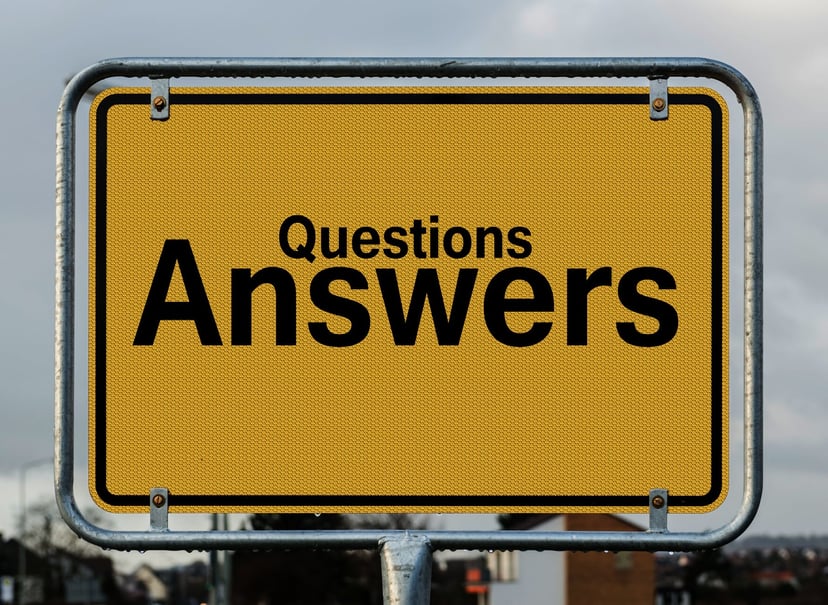 a yellow road sign with the words 'questions answers' on it