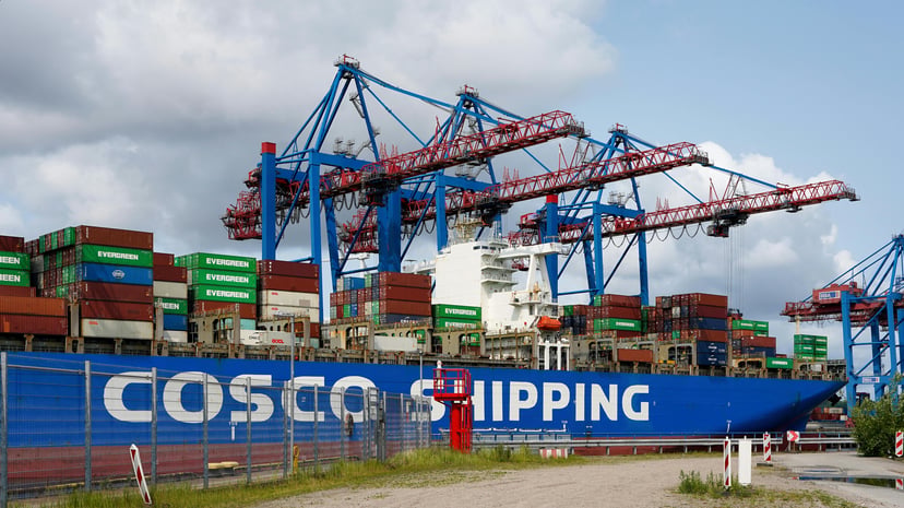 A COSCO container ship moored in a port