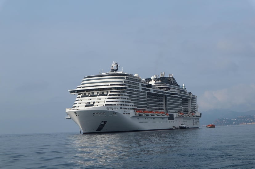 The cruise ship MSC Meraviglia at sea under a gloomy sky