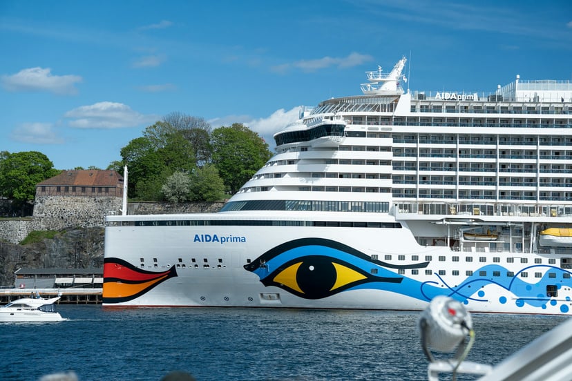 The AIDAprima cruise ship in a historic port