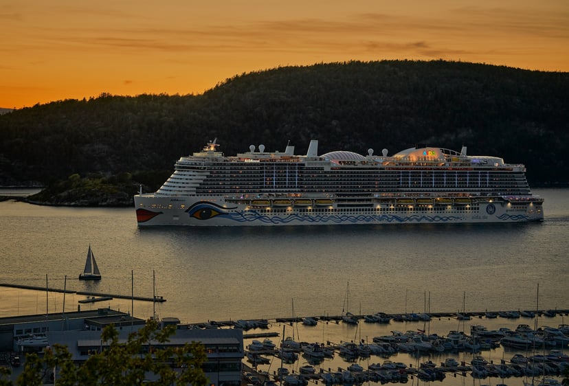 The AIDAnova cruise ship at sunset