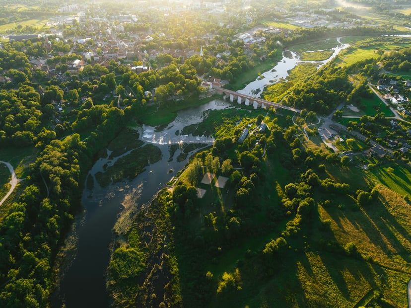 An aerial view of the River Rhine showing countryside and a bridge