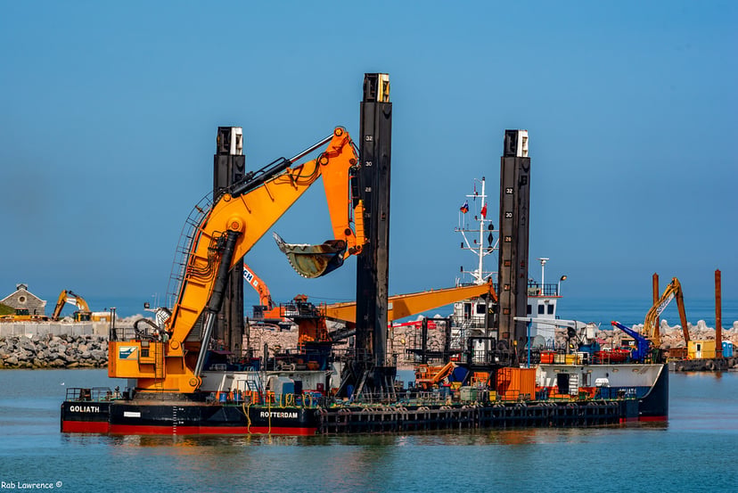 a backhoe style dredger working offshore