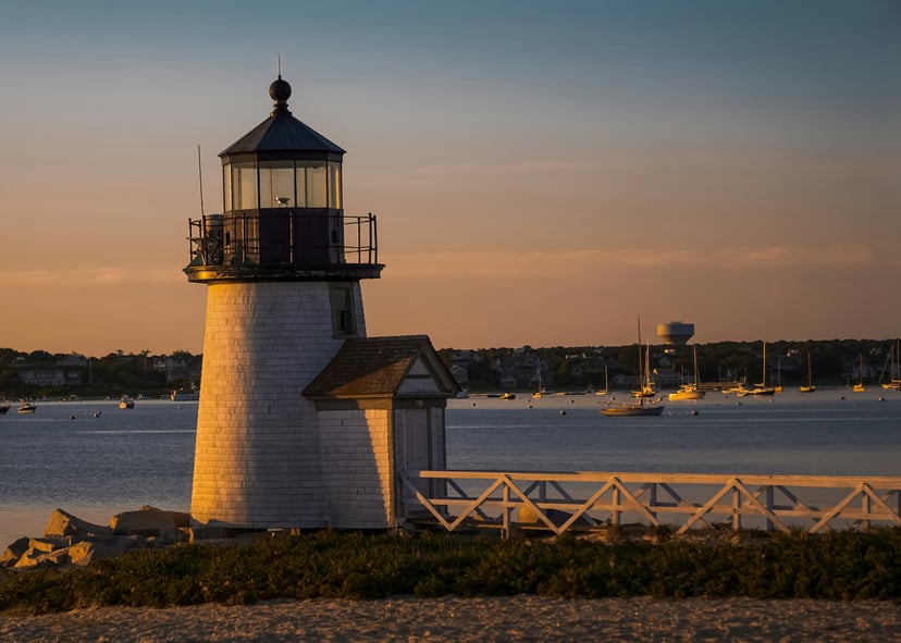 Lighthouse and dock on Nantucket Island at dusk