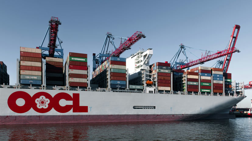 An OOCL container ship docked in a port