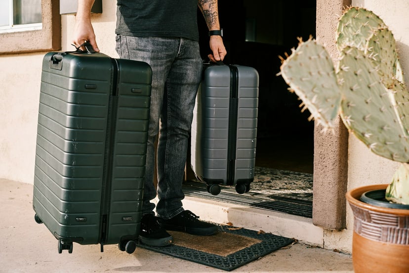 A man leaving home with two suitcases