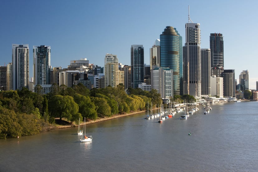 yachts moored alongside the skyscrapers of Brisbane's waterfront