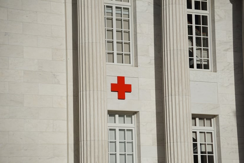 A red cross on a hospital exterior