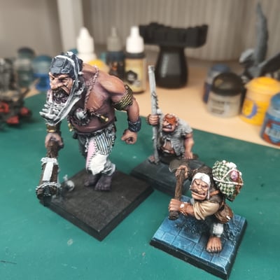 An old world giant, and two ogres half painted.