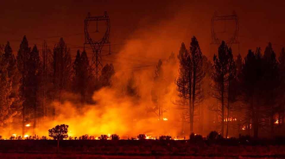 Oregon forest fire near electrical high voltage transmission lines