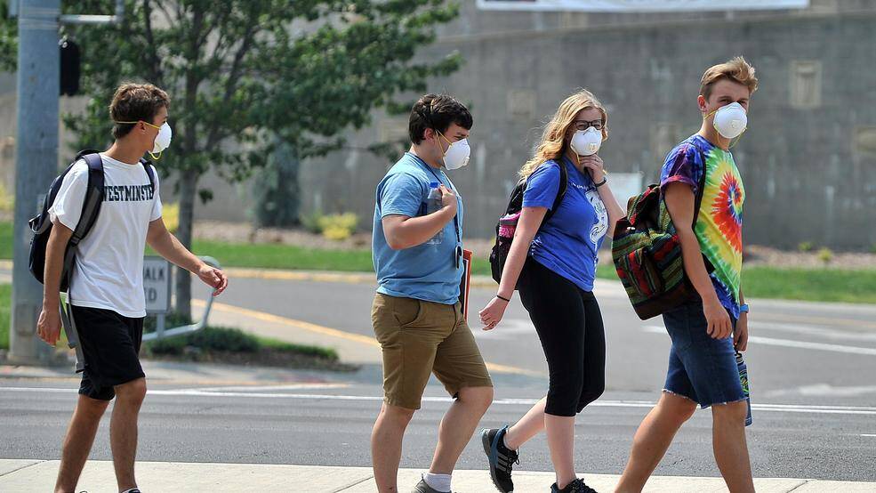 From left, Nickolas Tassopouls, Ray Barb, Hannah Berg and Patrick Pulpan wear protective masks