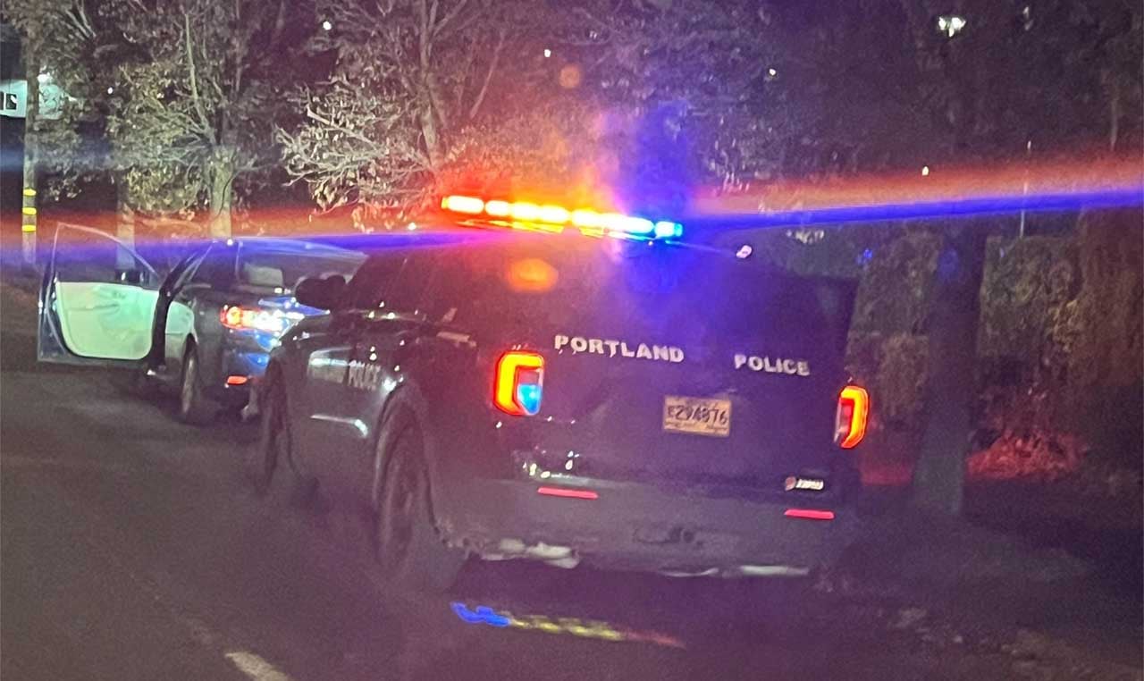 Portland Police patrol vehicle stopped behind a suspect vehicle