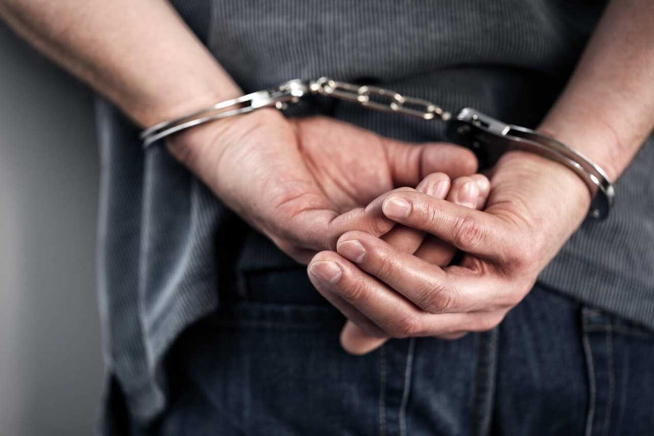 Criminal in hadcuffs - Police arrest - Oregon