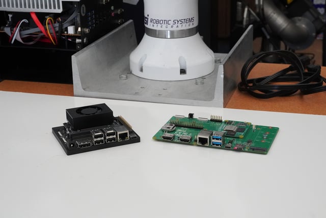 NVIDIA Jetson Orin Nano and Raspberry Pi Compute Module 5 next to an articulated robot arm at RSI headquarters