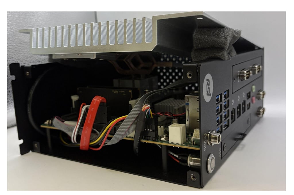 Open iPC400 chassis showing the heatsink assembly and internal component access