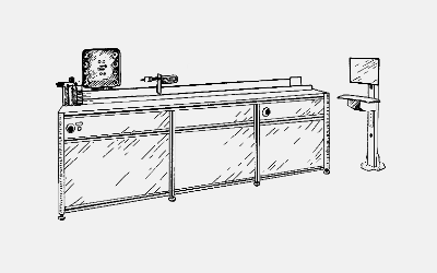 Industrial coil winding machine with long enclosed frame and operator console