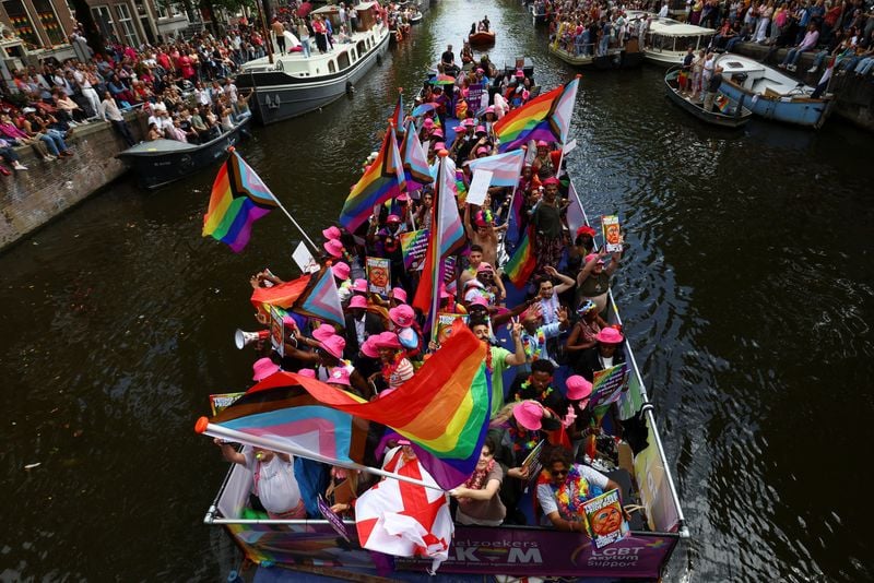 Image for Amsterdam Pride parade blends celebration and protest in LGBTQ+ show of solidarity