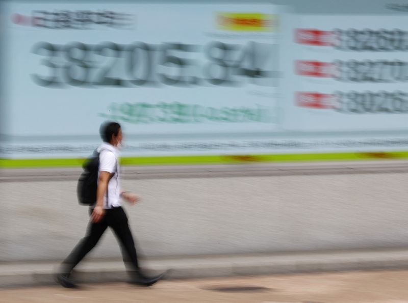 Image for Stocks mostly flat but earnings a positive; gold drops 5%